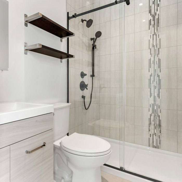 Bathroom plumbing around toilet and vanity
