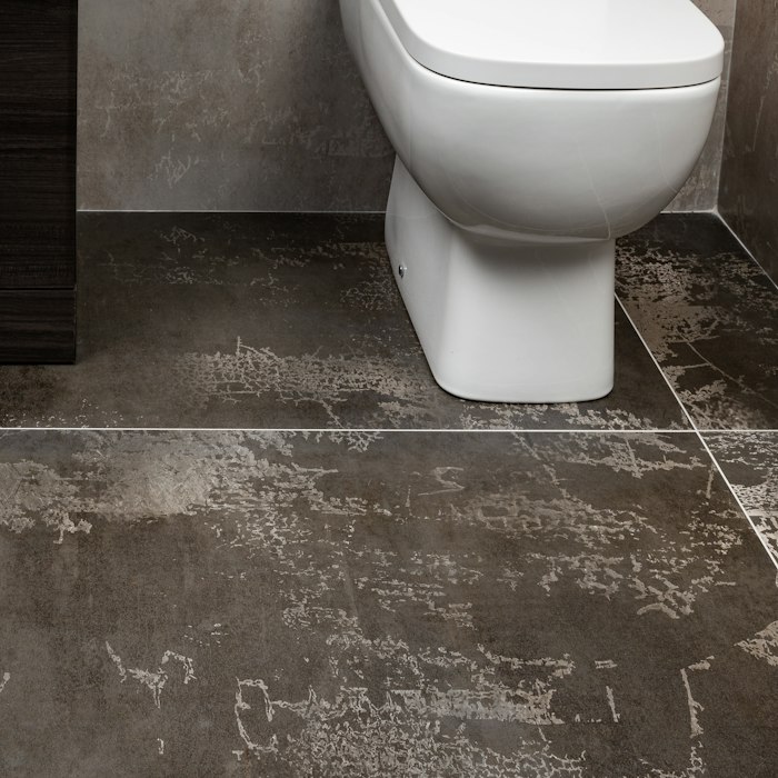 Moisture check around a leaking toilet base